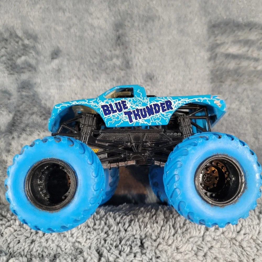 Hot Wheels Monster Jam Blue Thunder and NEA Police 1:64 Diecast Truck Lot of 2