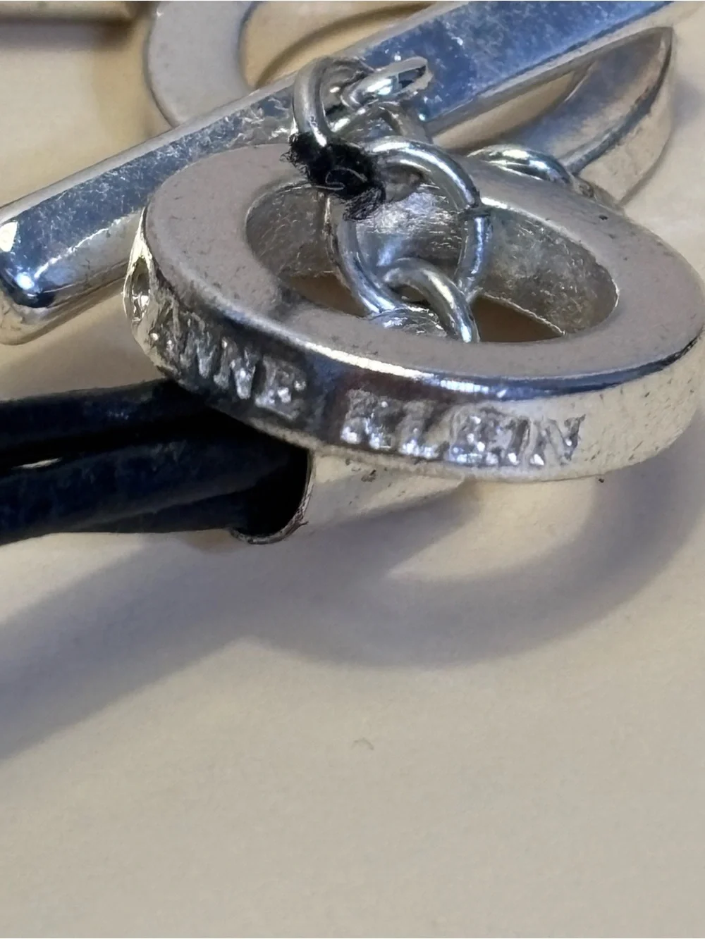 Anne Klein Silver Multi-Ring Pendant Toggle Necklace with Black Cord 18”+1”