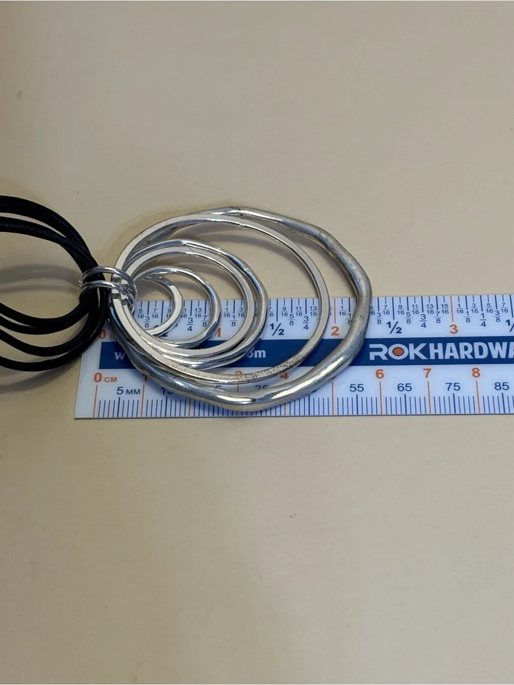 Anne Klein Silver Multi-Ring Pendant Toggle Necklace with Black Cord 18”+1”