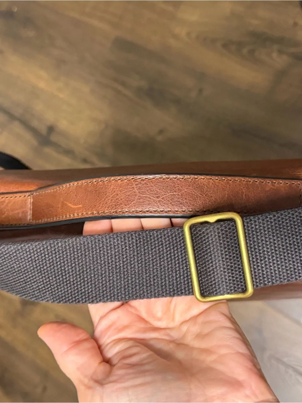 Fossil embossed brand messenger