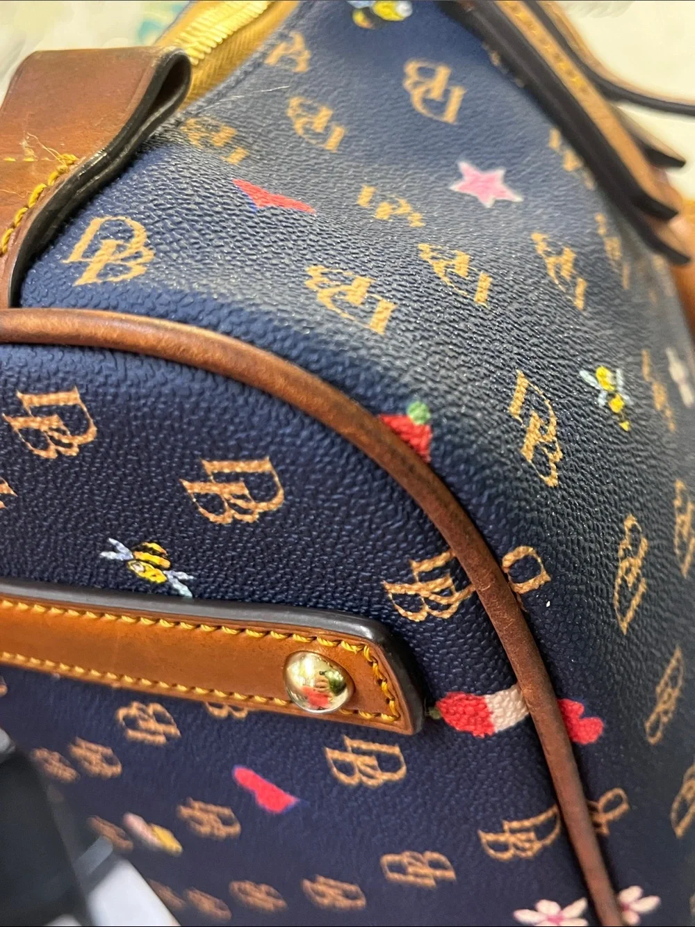 Dooney & Bourke Navy Satchel with Brown Trim and Multicolor Motifs
