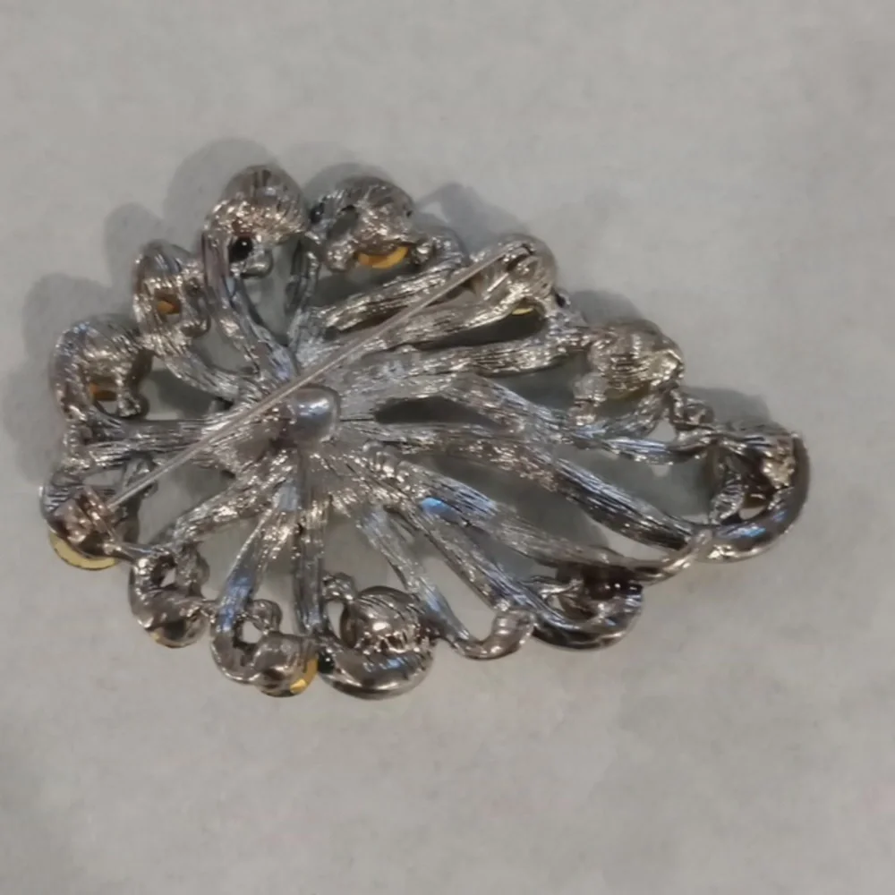 Elegant Silver and Green Brooch