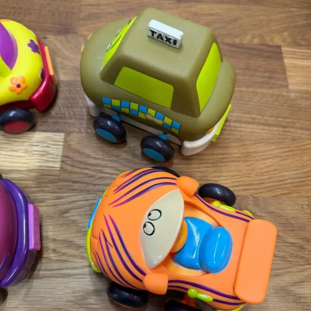 B. Toys Pull Back Trucks Taxi Cab Convertible Lot of 4 Flower Car Play Imaginati