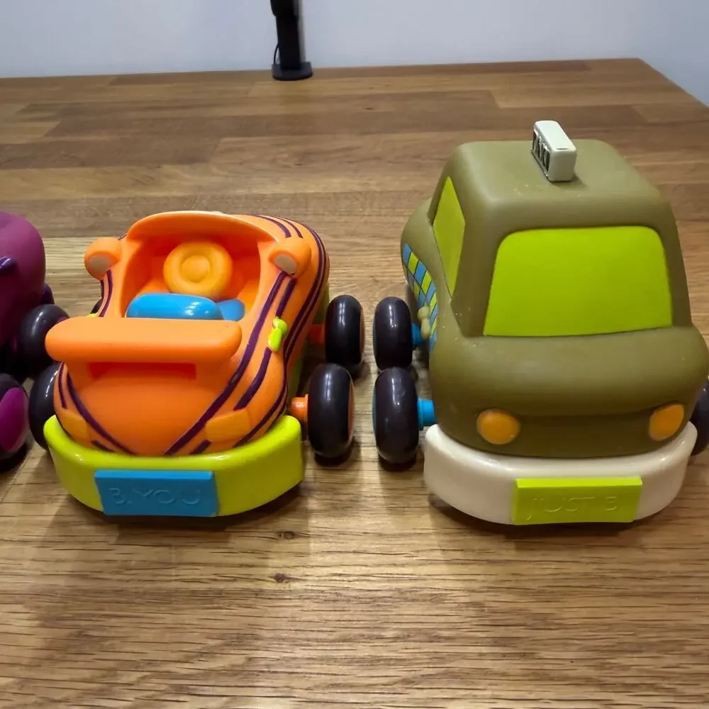 B. Toys Pull Back Trucks Taxi Cab Convertible Lot of 4 Flower Car Play Imaginati