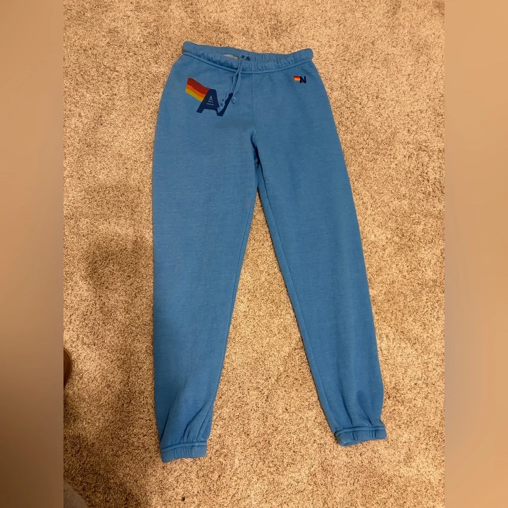 Aviator Nation Blue Track Joggers with Rainbow Logo