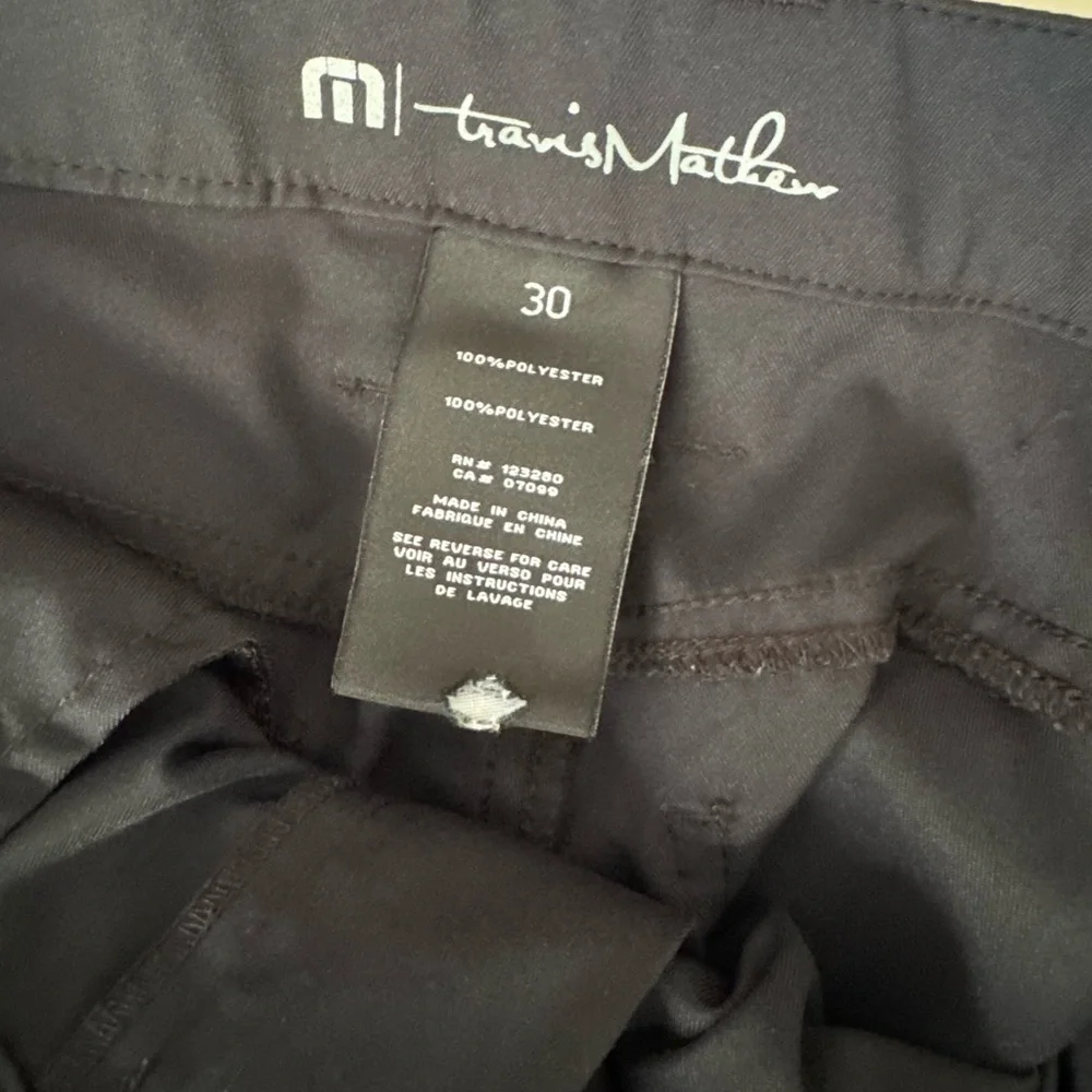 Travis Mathew sleek dark