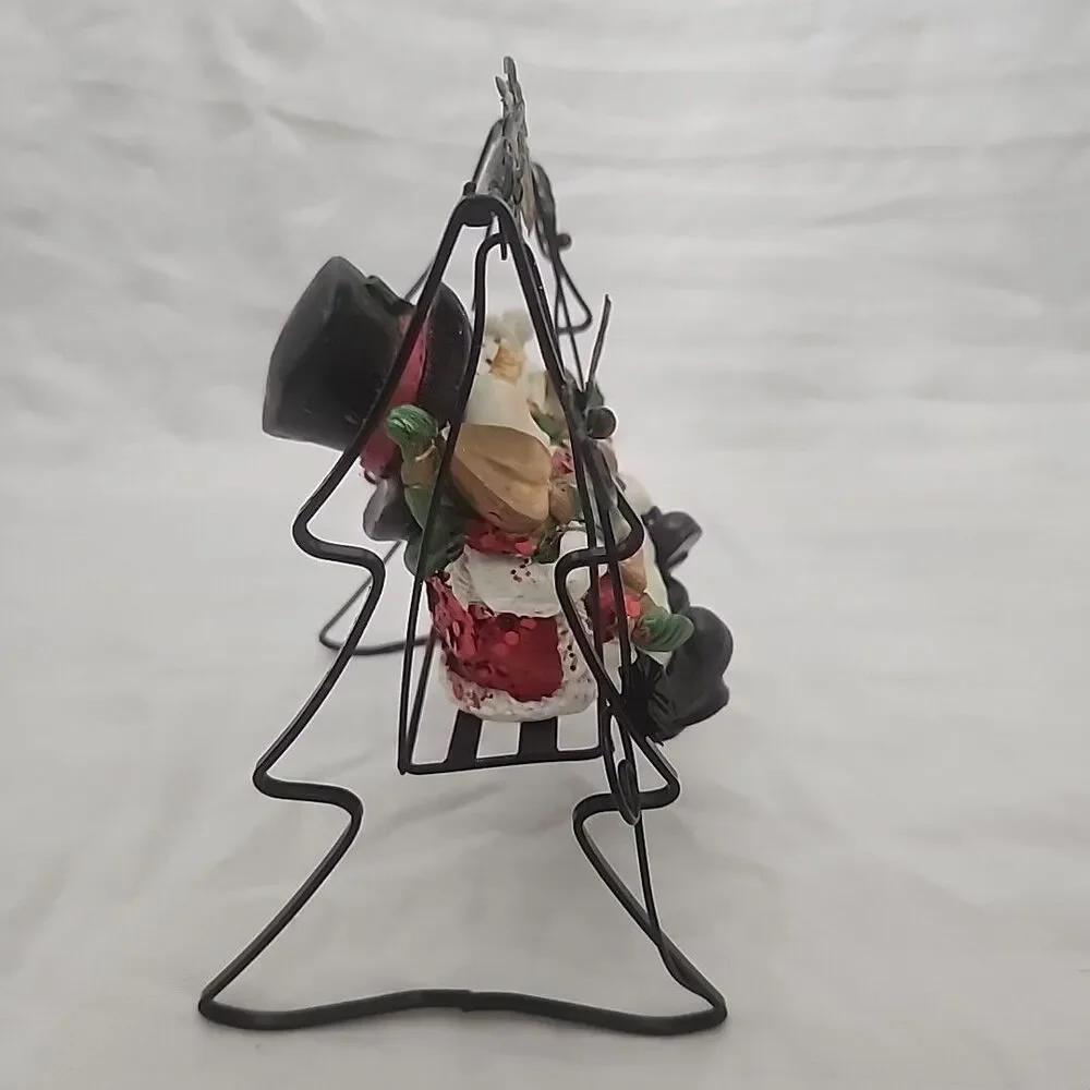 Swinging Snowman Couple Adorned With Glitter, Snowflakes, Bells, And Holly Berry