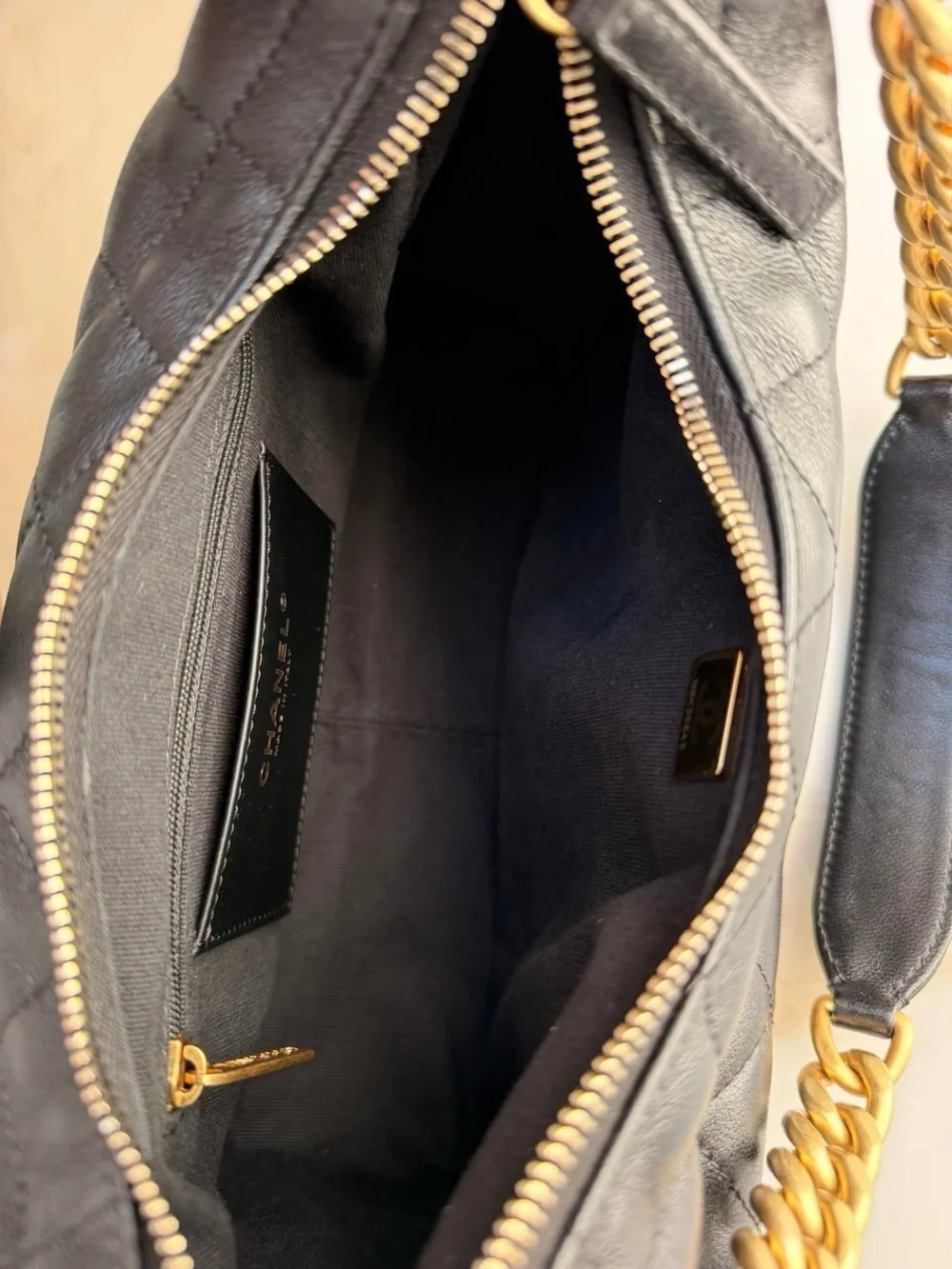 CHANEL Black Quilted Leather Hobo Bag with Gold Chain