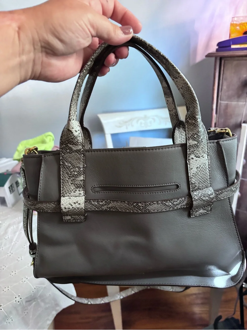 Fossil Willow satchel in gray leather, highlighted by a distinctive snake-print
