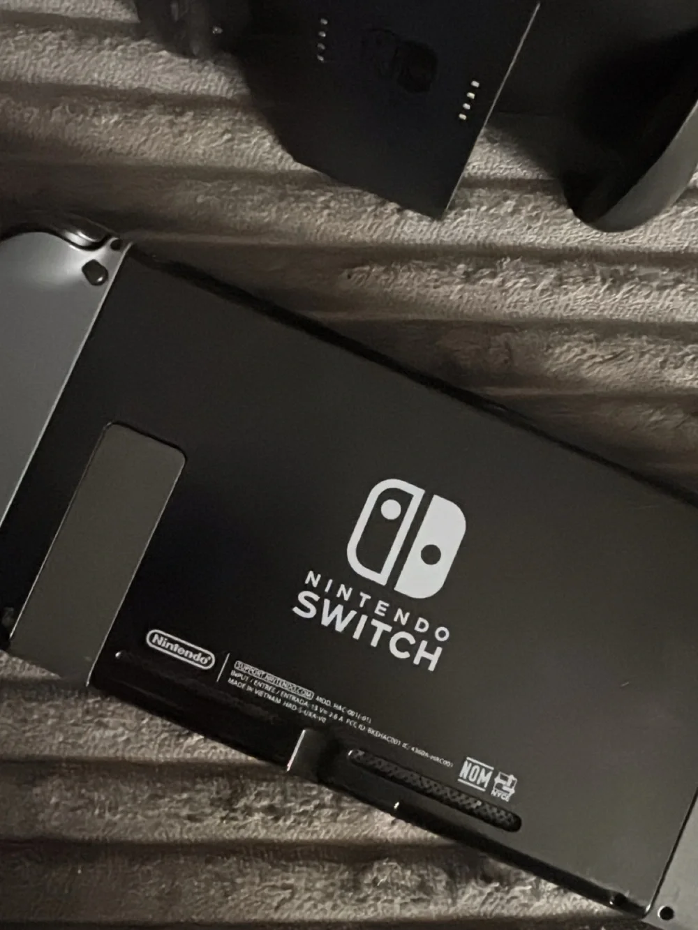 Nintendo Switch Console with Gray Joy‑Con and Black Dock