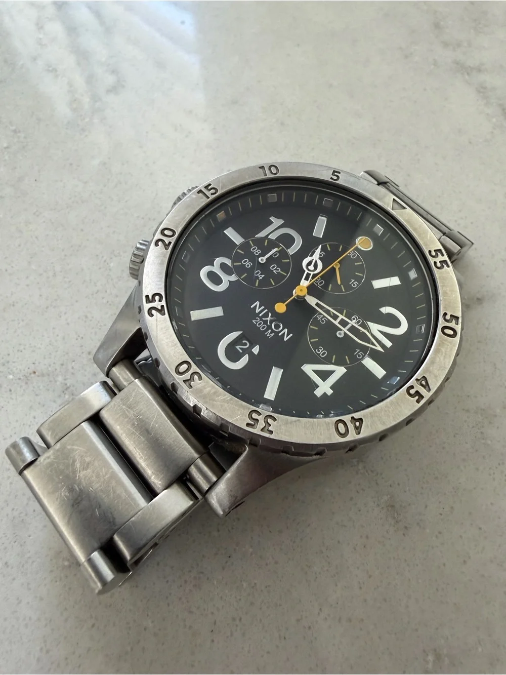 Nixon Stainless Steel Chronograph Watch — Black Dial with Yellow Accents