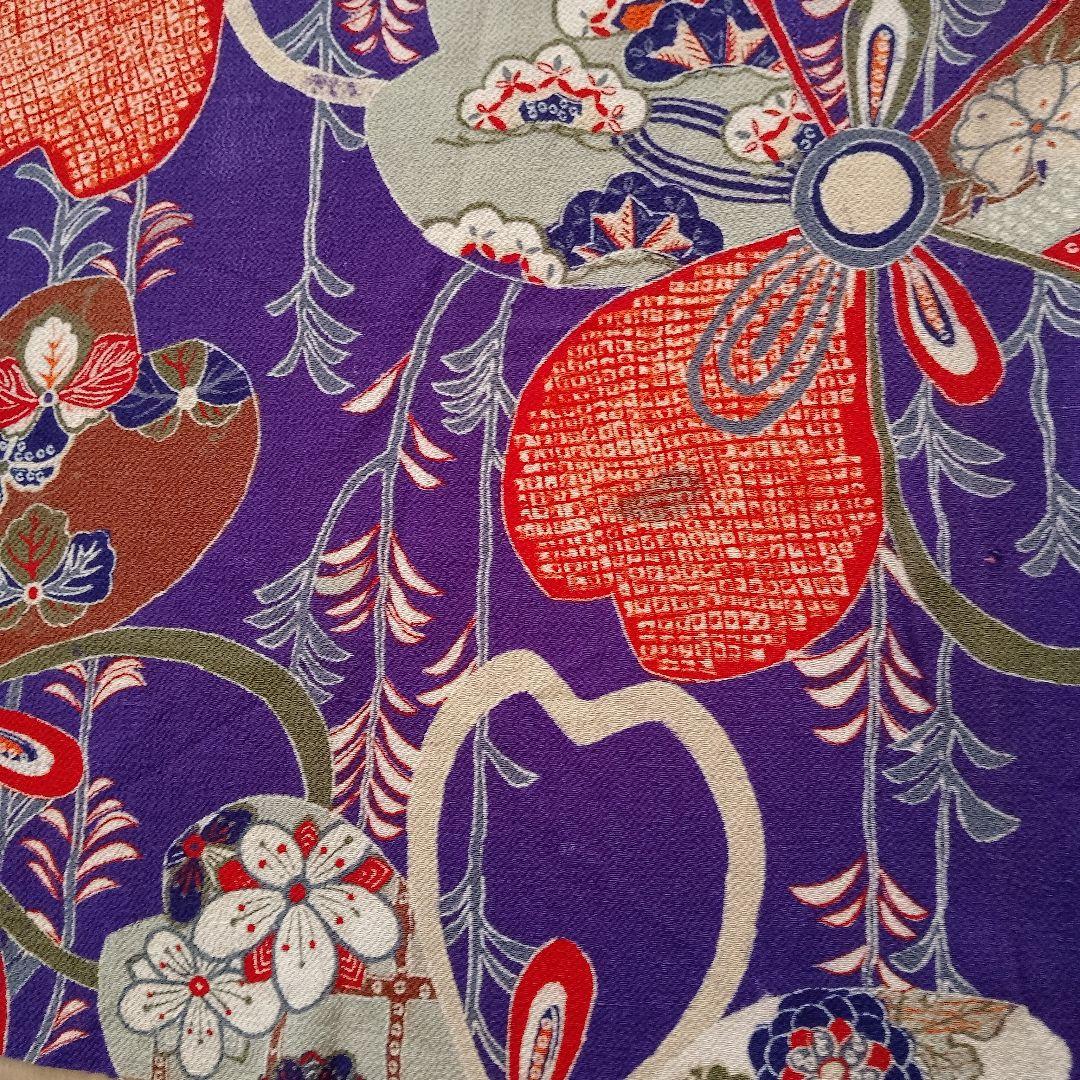 Pure silk chirimen (crepe fabric) with a purple background and cherry blossom pattern