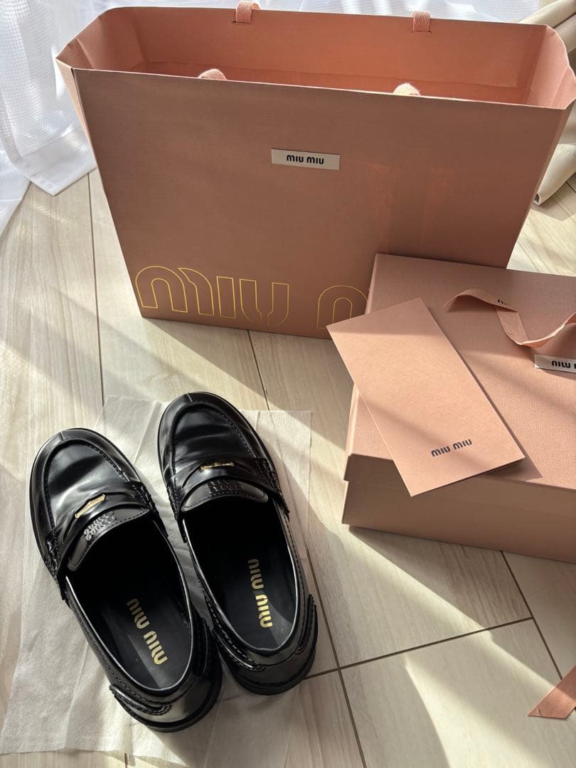 Almost new Miu Miu black leather loafers, size 23.5cm